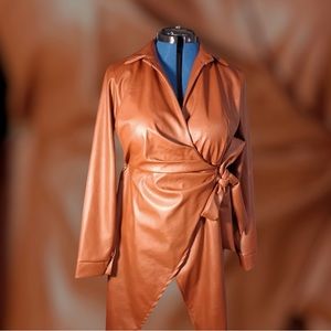 Long sleeve copper faux leather tie up dress. Size medium in good condition.